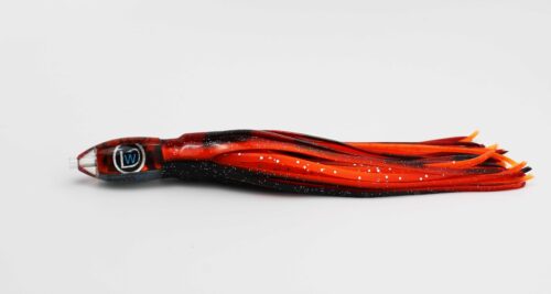 A red and black striped fishing lure on a white surface.